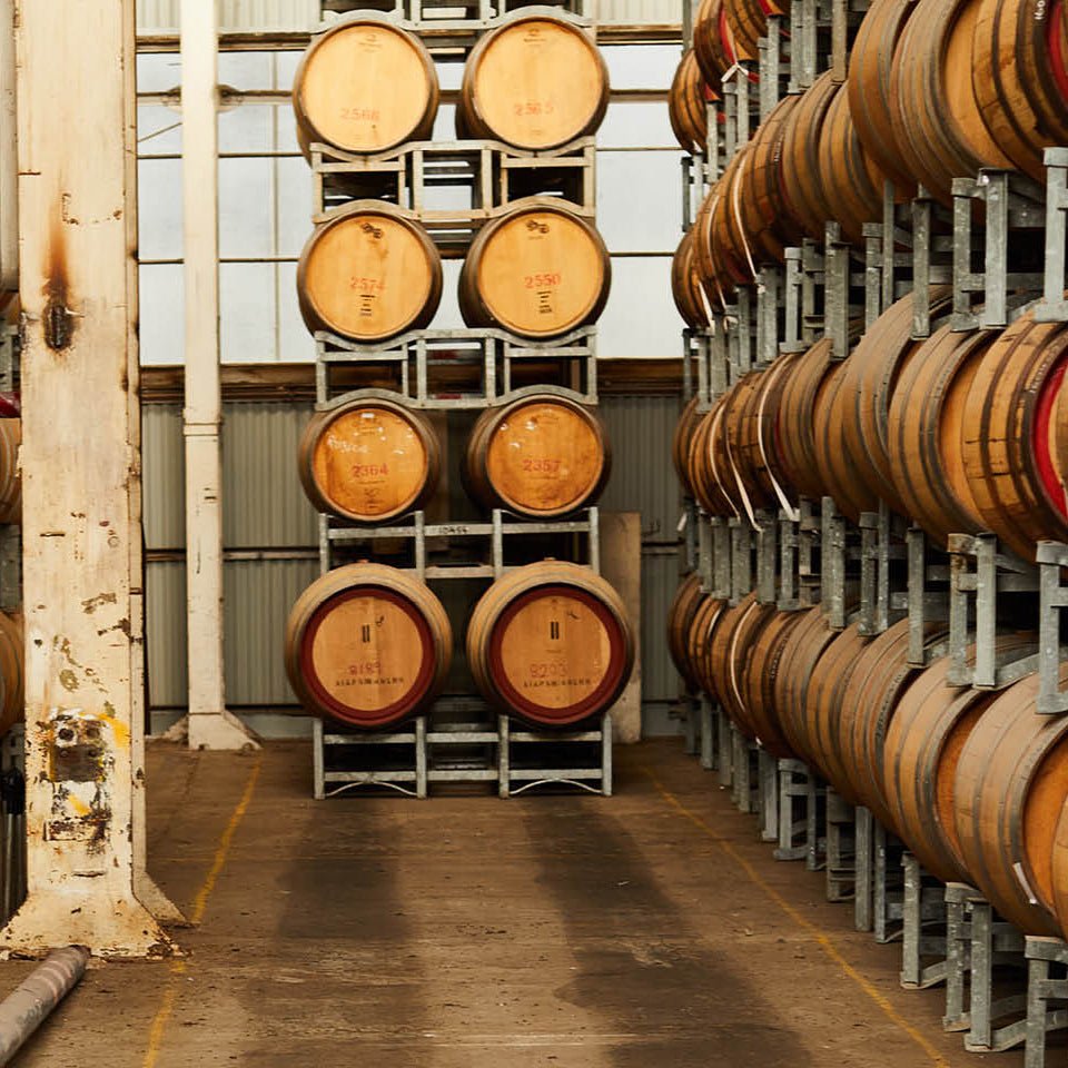 barrel stacks warehouse wooden pillars whisky